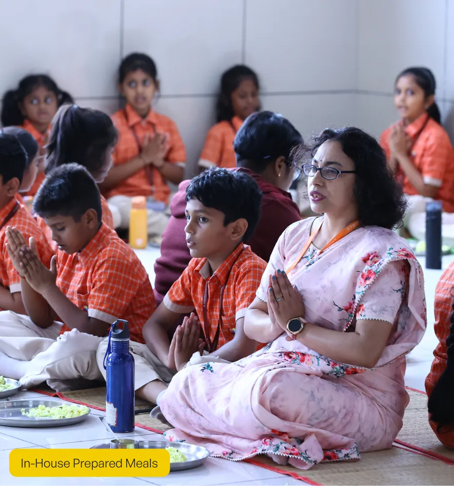 Vishwa Vidyapeeth students having in-house prepared meals at the school in Varthur